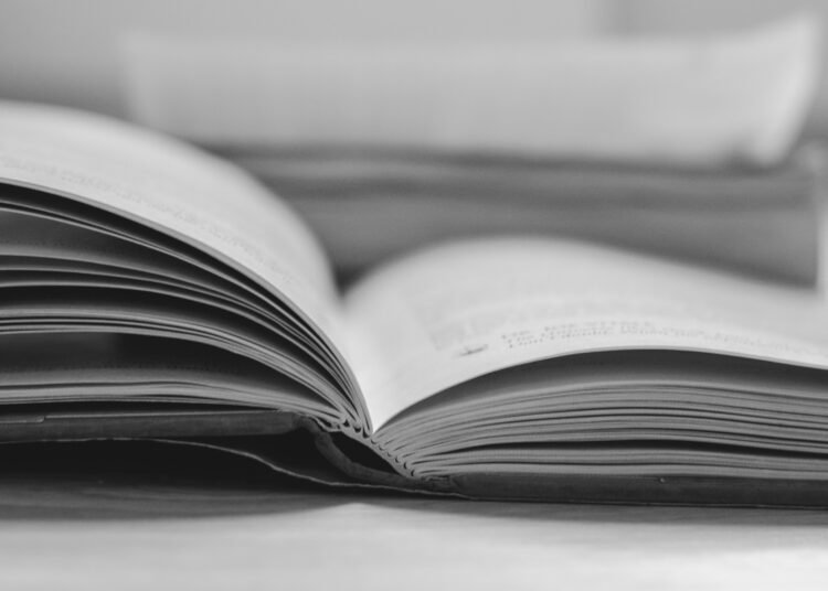 an open book sitting on top of a table