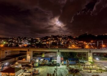 city with high rise buildings during night time