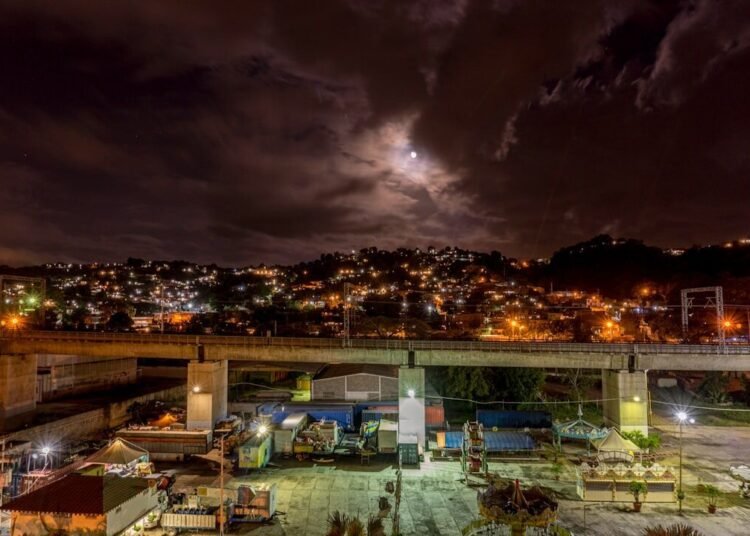 city with high rise buildings during night time