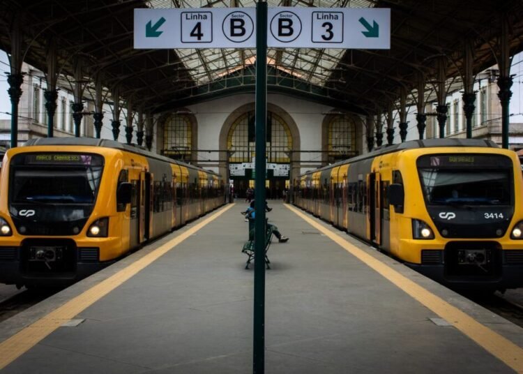 Symmetrical view of two trains at São Bento Station in Porto, Portugal.
