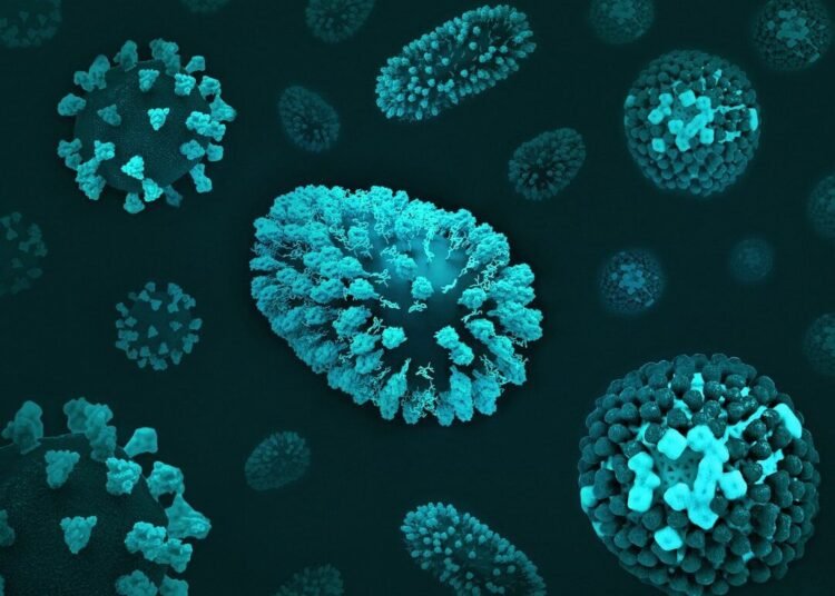a group of blue and green cells on a black surface