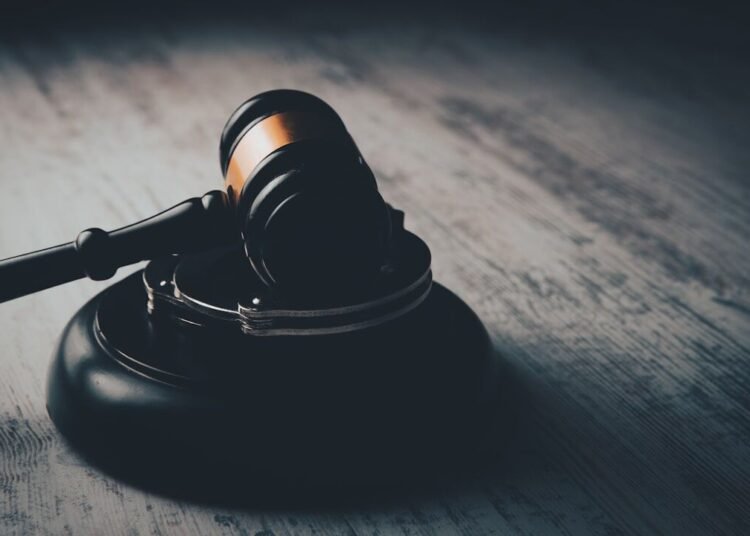 a judge's gaven on a wooden table