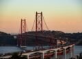 red bridge over the river during daytime